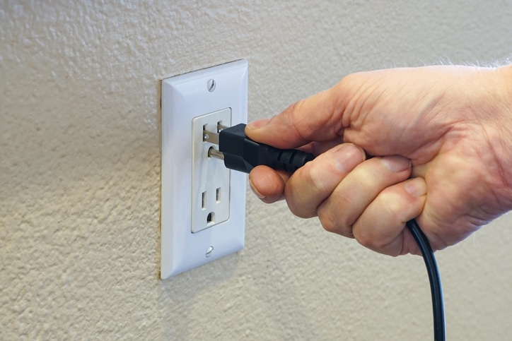 Electrician installing and testing electrical outlets and switches for safe home power in Murrieta CA