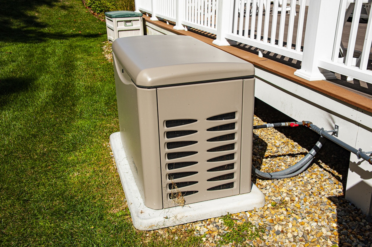 A backup generator sits on the side of a Murrieta, CA, home, keeping it powered during a rolling blackout.